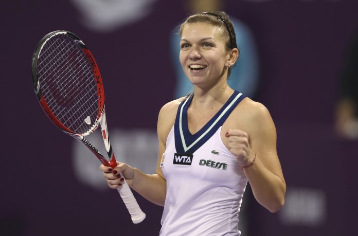 Simona Halep celebrates after defeating Angelique Kerber in their women's singles final match of the Qatar Open tennis tournament in Doha